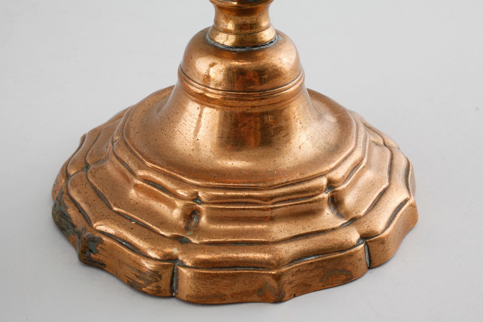 A pair of late barouqe bronze candlesticks, 18th century.