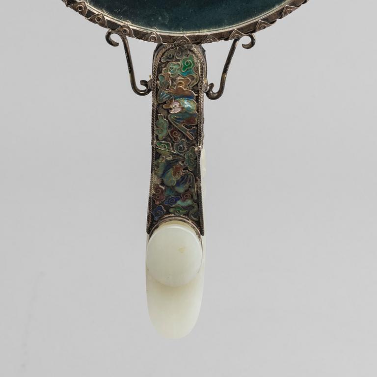 A Chinese silver mirror with carved nephrite placque and belt hook, early 20th Century.