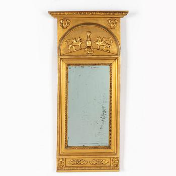 A giltwood Empire mirror by J. P. Holmberg (active in Stockholm 1813 - 1831).
