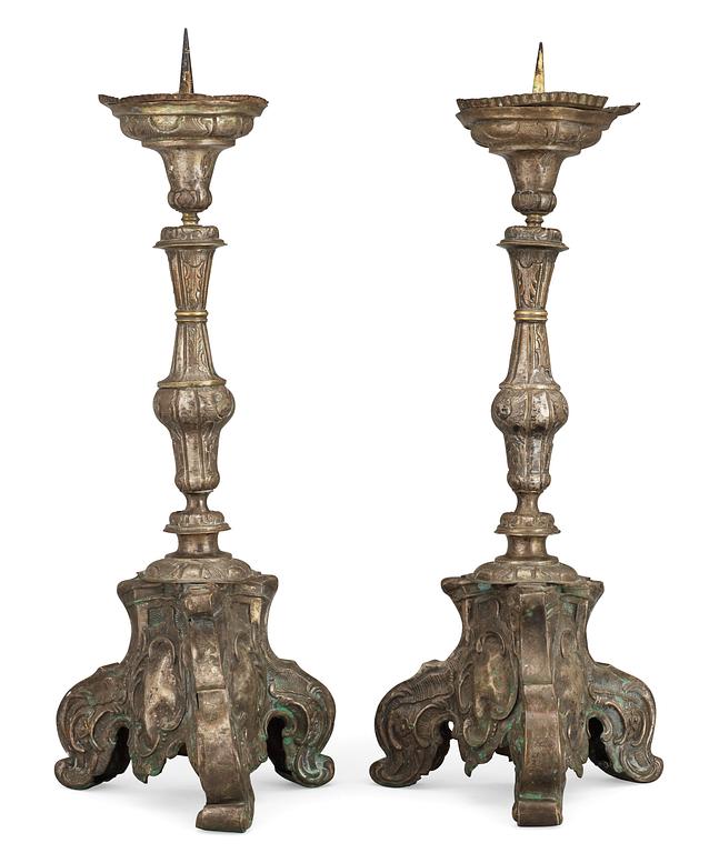A pair of Baroque 18th Century altar candlesticks.
