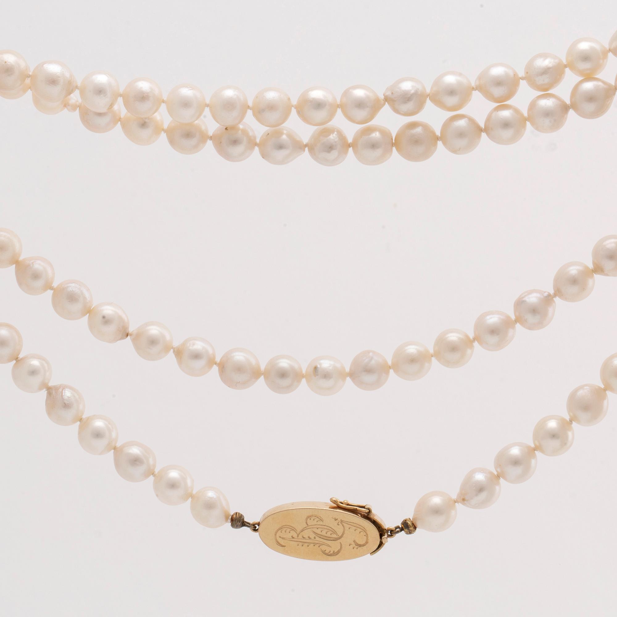 PÄRLCOLLIER odlade pärlor ca 7,5 mm lås i 18K guld , längd ca 85 cm.