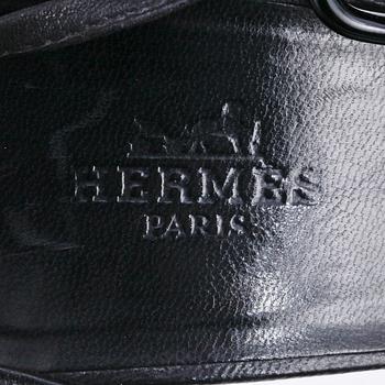 HERMÈS, a pair of black leather sandals. Size 38.