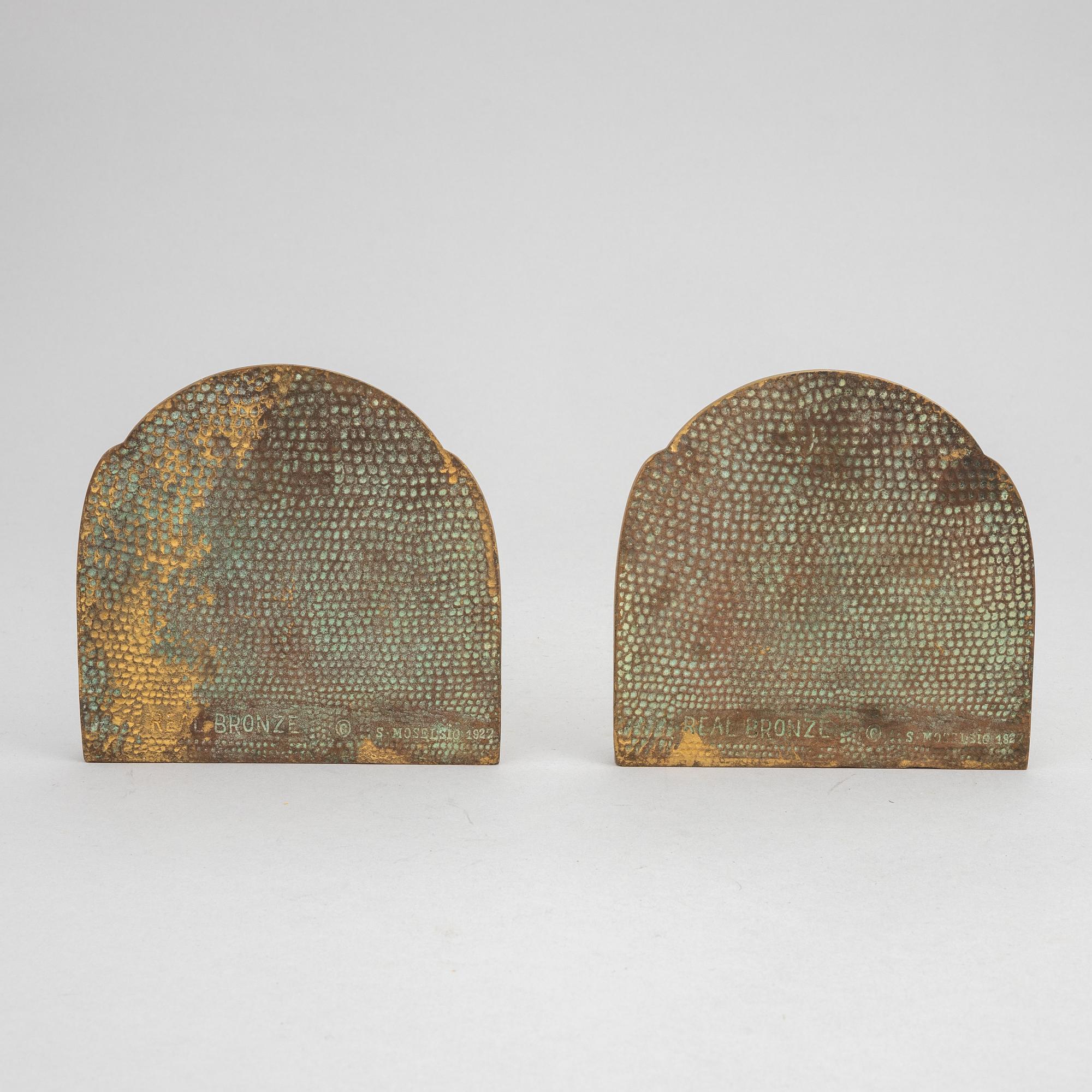 Simon Moselsio, a pair of bronze bookends, 20th Century.