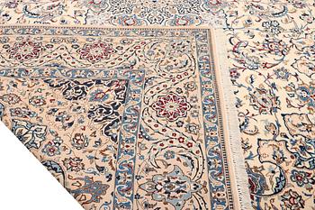 A Nain, part silk carpet, c. 474 x 322 cm.