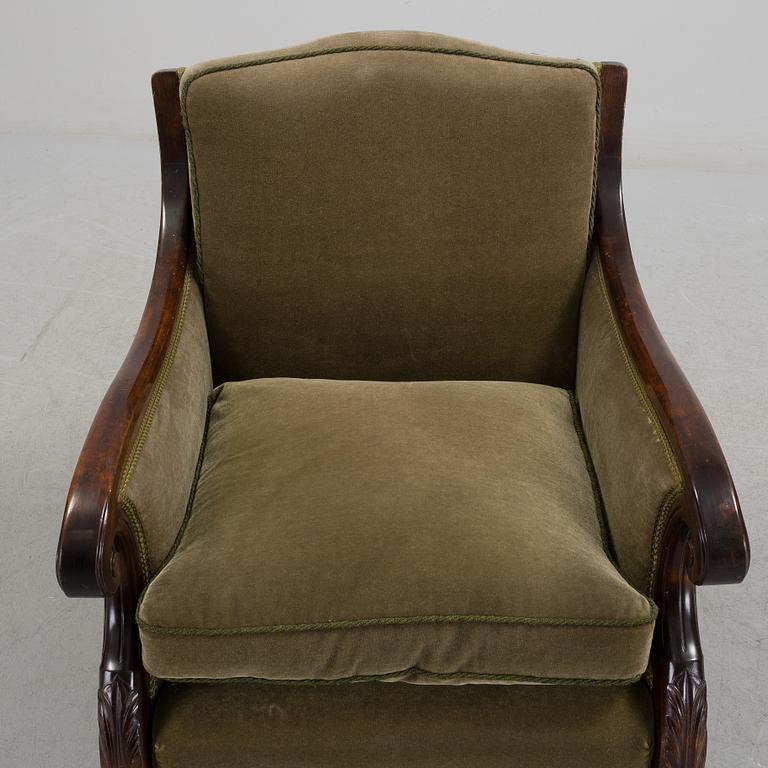 A pair of armchairs and a table, mid 20th century.