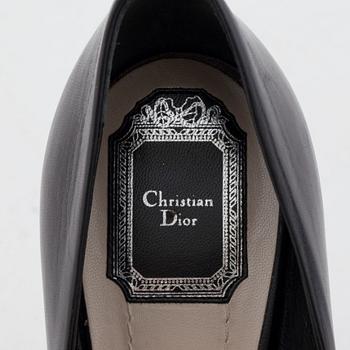 CHRISTIAN DIOR, a pair of black leather open toed pumps.