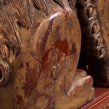 A pair of Chinese massive lacquered Buddhist lions, first half of the 20th Century.