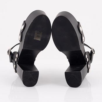 Prada, a pair of wood and leather sandals, size 37.