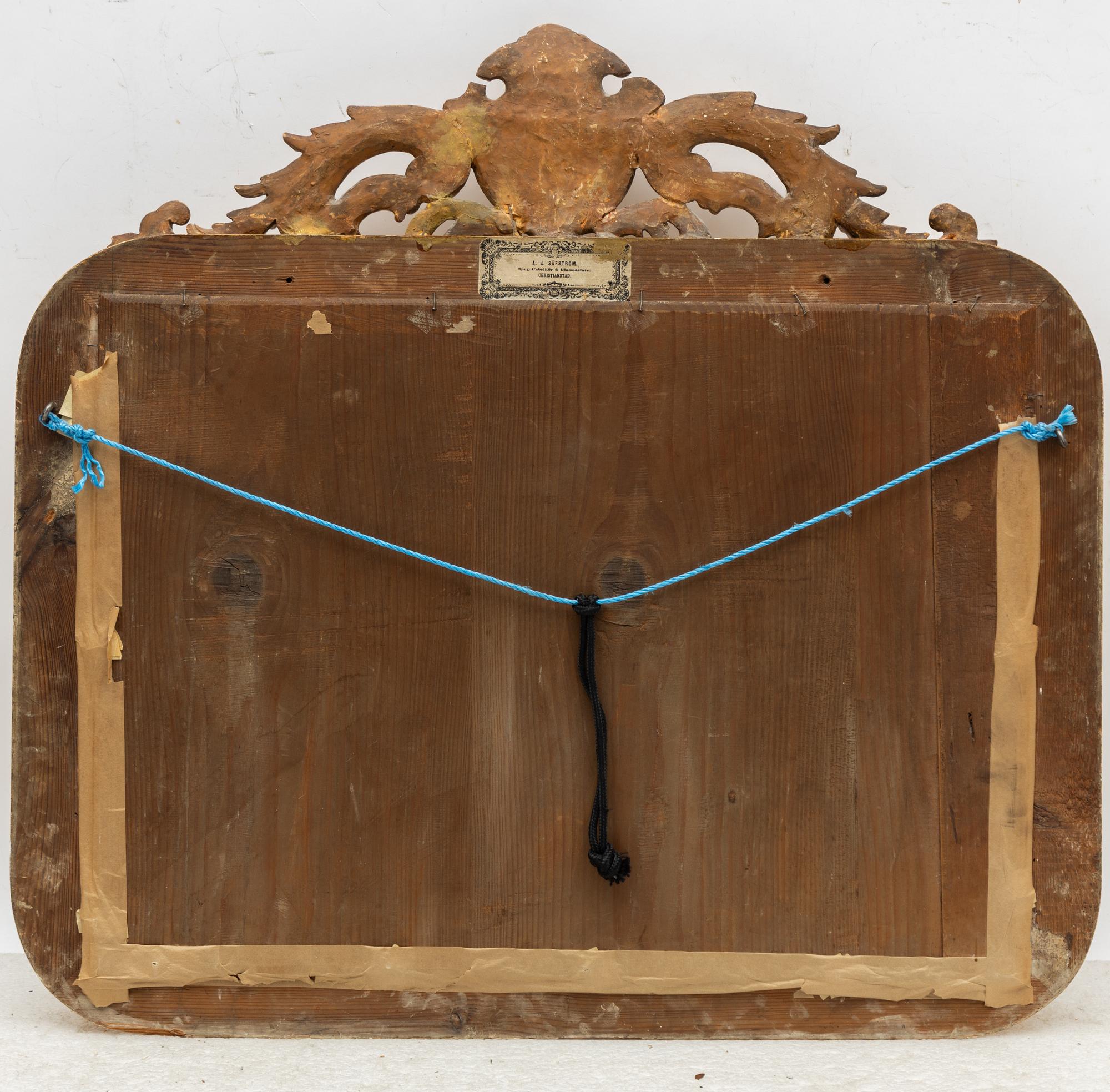 A rococo style mirror by AG Säfström Kristianstad from around the year 1900.
