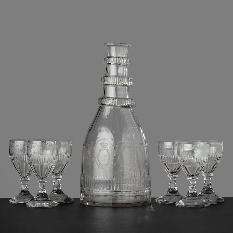 A large bottle and six glasses, Sweden, Reijmyre glassworks, circa 1810. Engraved by Anders Spolander.