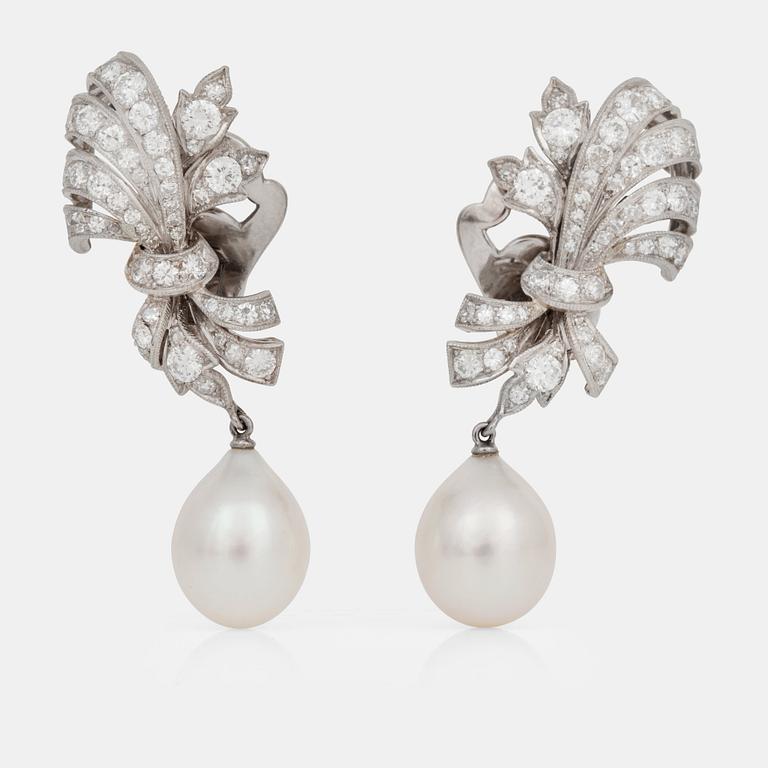 A pair of cultured pearl and diamond earrings.