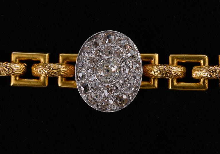 RANNEKORU, 56 kultaa vanhahiottuja timantteja n. 2.65 ct. Pietari 1898 - 1903. Paino 23,6 g.