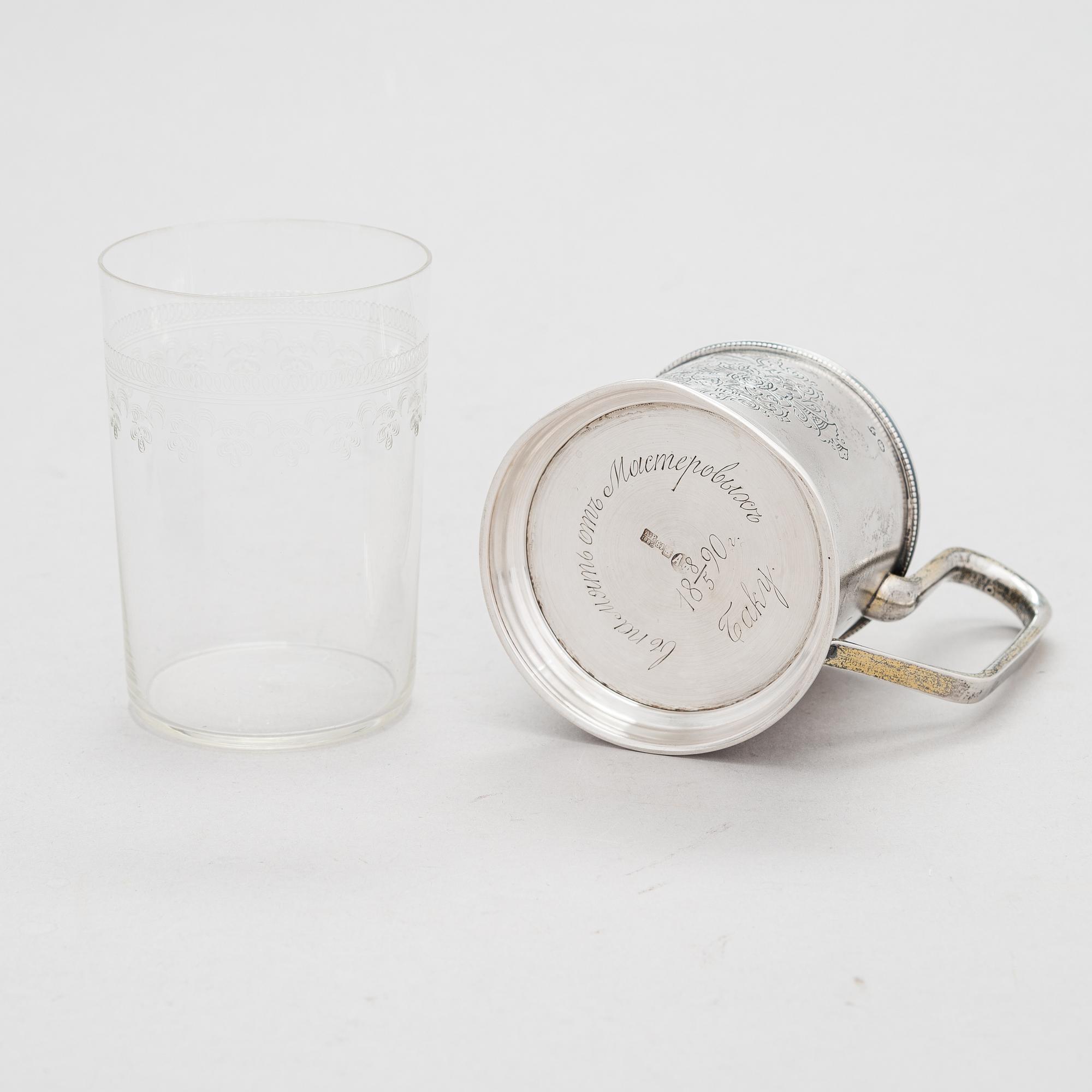 A Russian silver tea glass holder and a tea spoon, Moscow, Alexander Fuld 1889 and Antip Kuzmichev 1888. Glass, Finland.