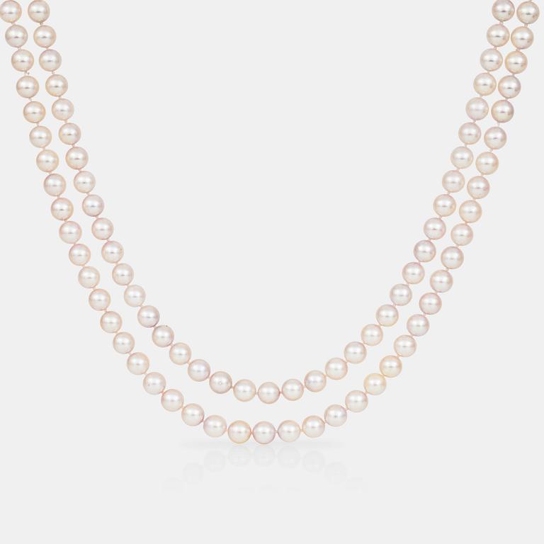 A cultured saltwater pearl necklace. Clasp set with brilliant-cut diamonds.