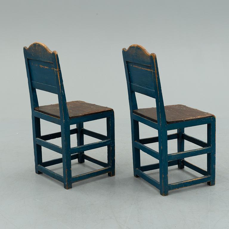 a pair of early 20th century chairs.