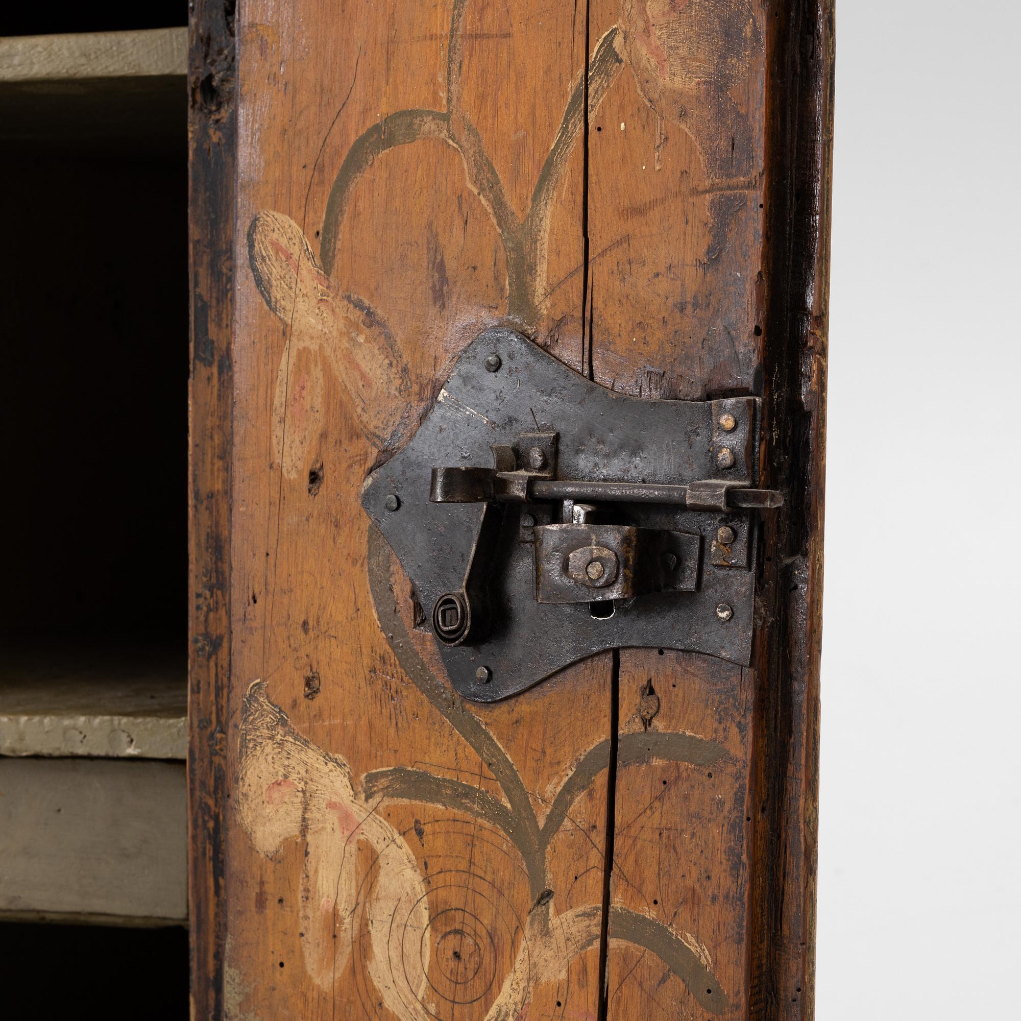 A wall cabinet, folk art, Västergötland dated 1773.