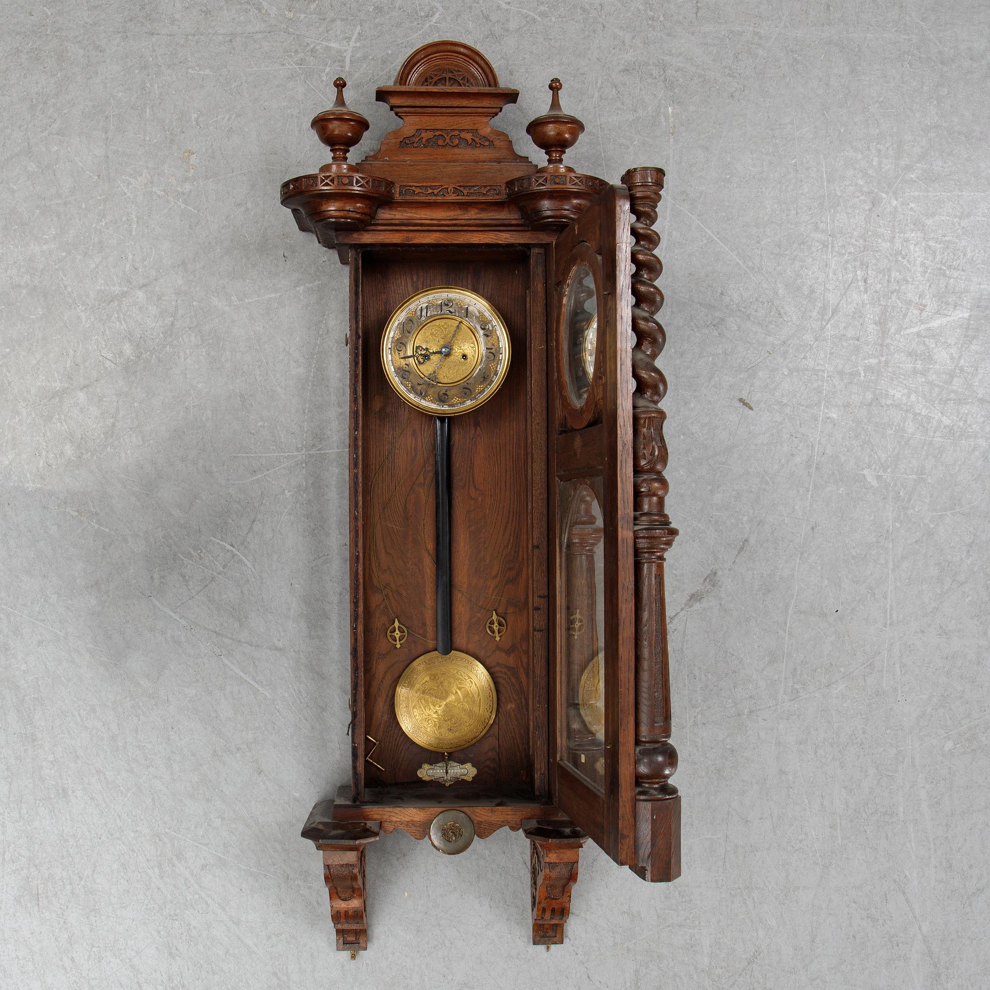 A Neo-Renaissance reugulator wall clock by Gustav Becker, late 19th Century.