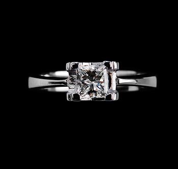 A RING, princess cut diamond 0.71 ct. H/vvs1 laserengraved ID no. GIA certifikat 18K white gold, weigth 5,1 g.