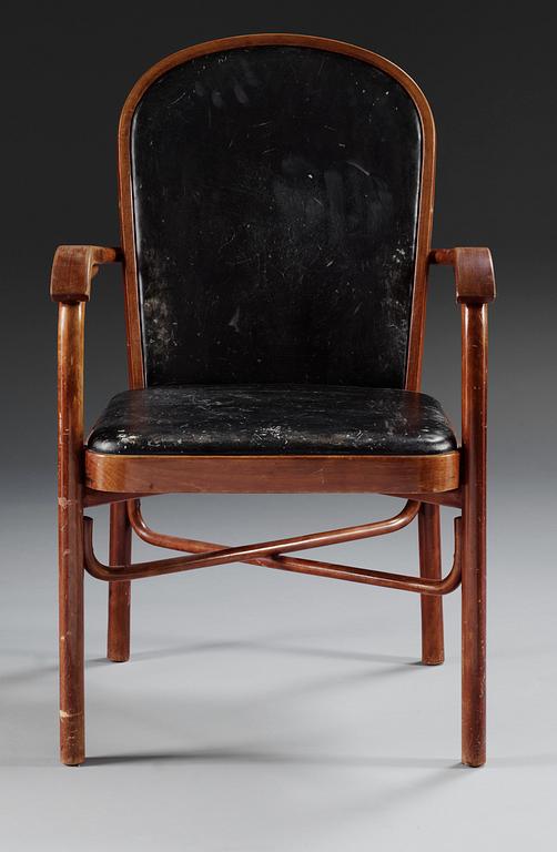A Sigurd Lewerentz stained beech and black leather chair.