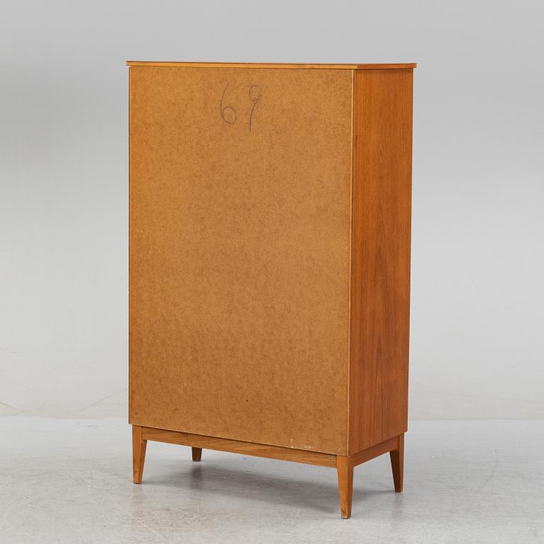 A teak veneered chest of drawers, 1950's/1960's.