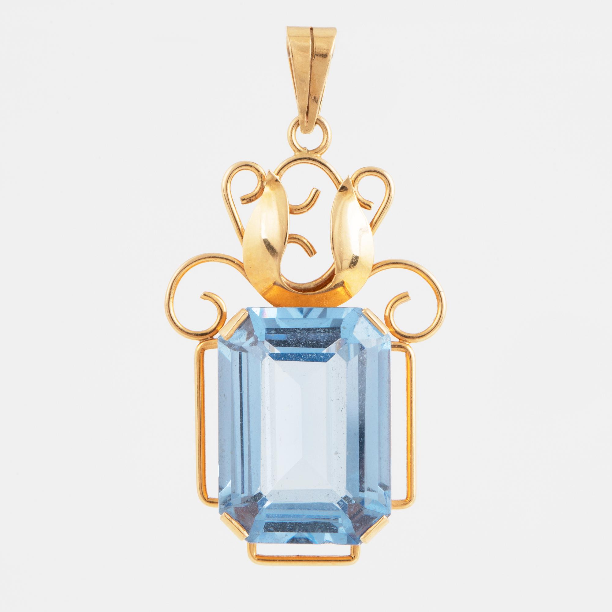 Blue synthetic spinel and 18K gold pendant.