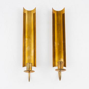 Pierre Forssell, a pair of brass wall scones "Reflex" from Skultuna, end of the 20th century.