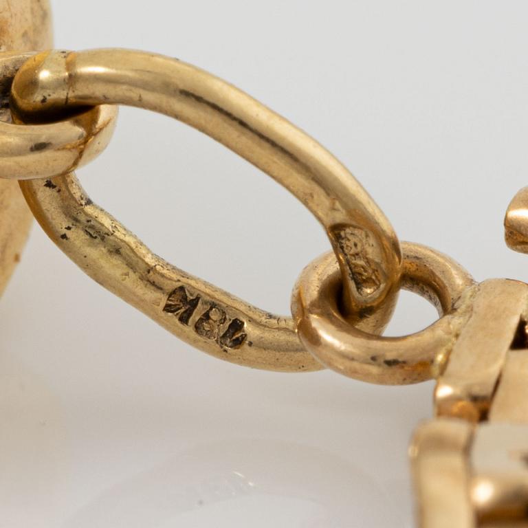 Armband med berlocker guld 18K guld.