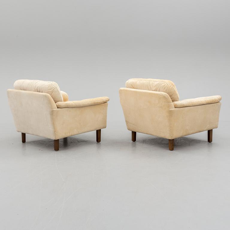 A pair of last quarter of the 20th century Dux easy chairs.