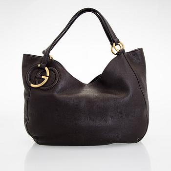 Gucci, an "Interlocking G" bag.