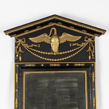 An Empire mirror by Jonas Frisk (Stockholm 1805-1824), and a later console table.