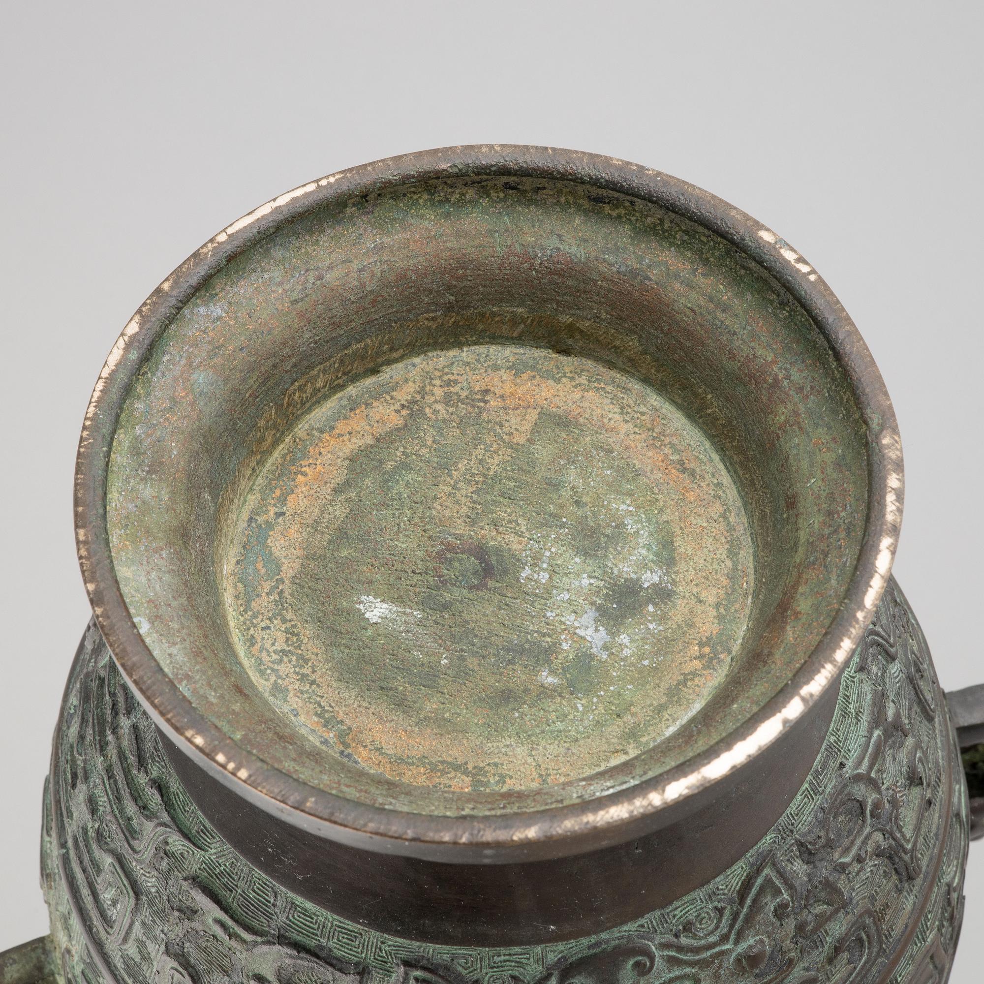 A pair of Chinese bronze urns, 20th century.