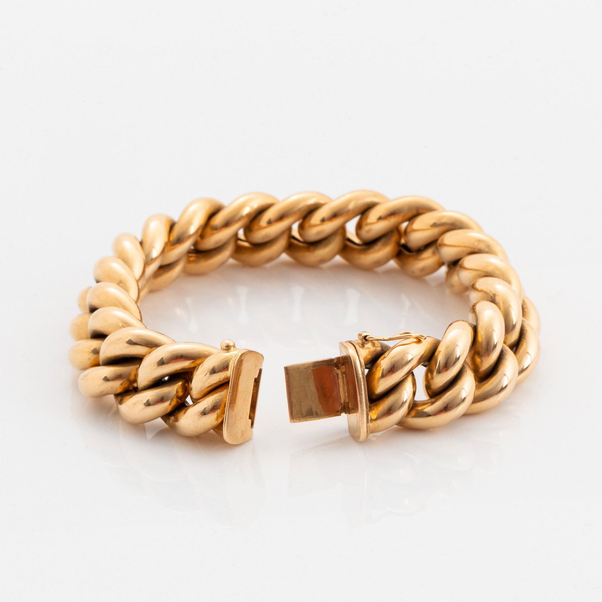 An 18K gold bracelet.