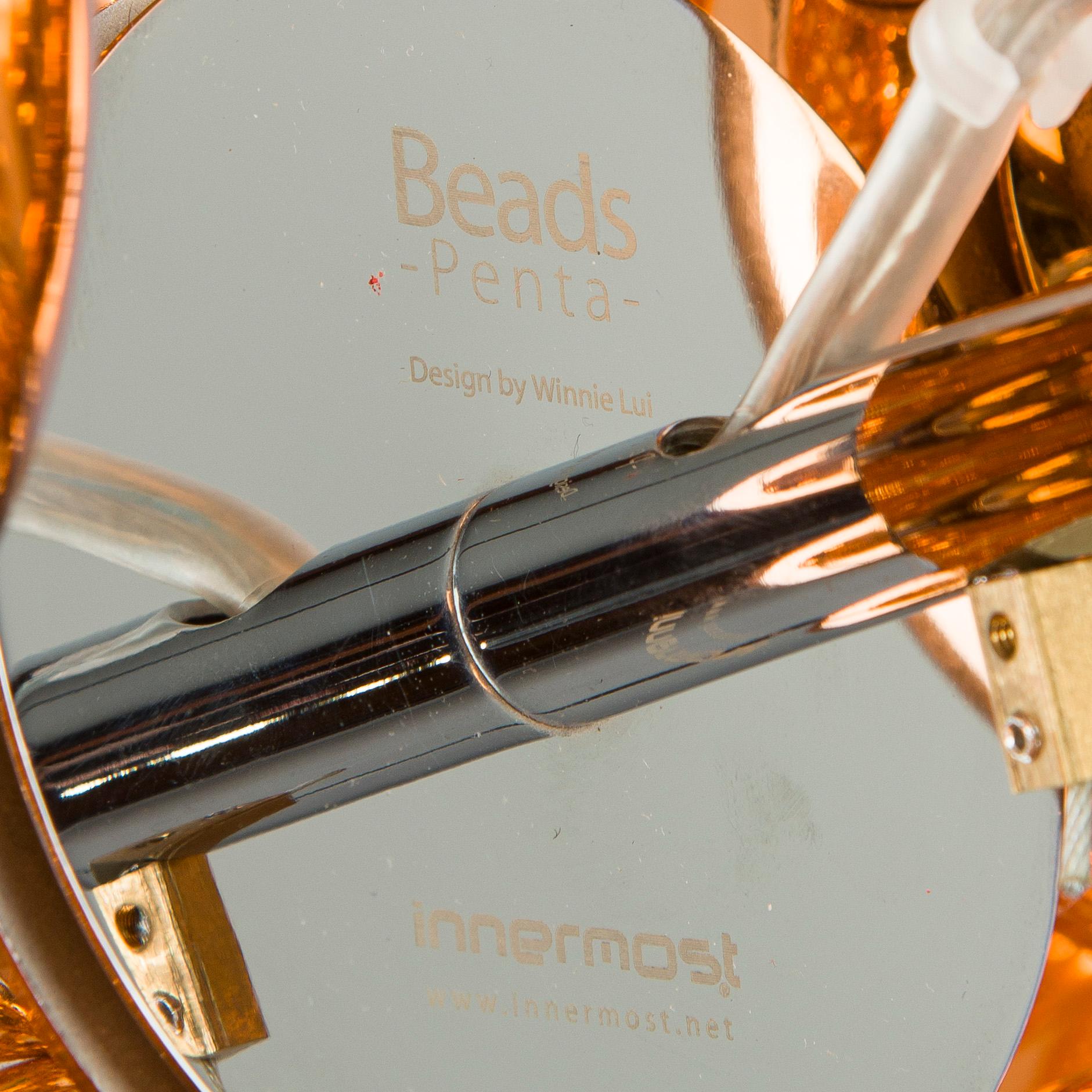 Winnie Lui, a 'Beads Penta' ceiling light, for Innermost.