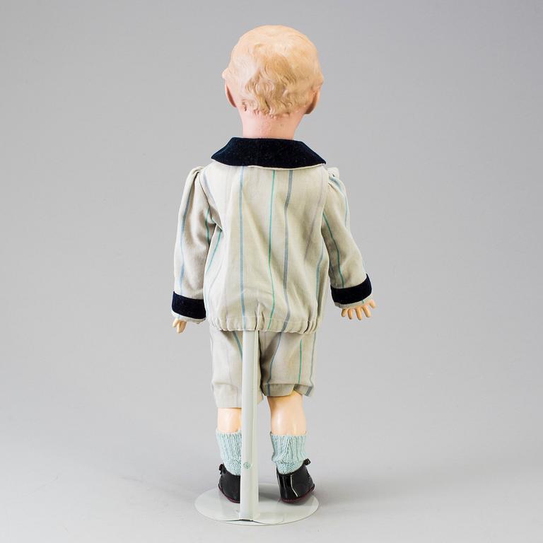 A bisque headed boy doll 7622 by Heubach, Germany, ca 1912.