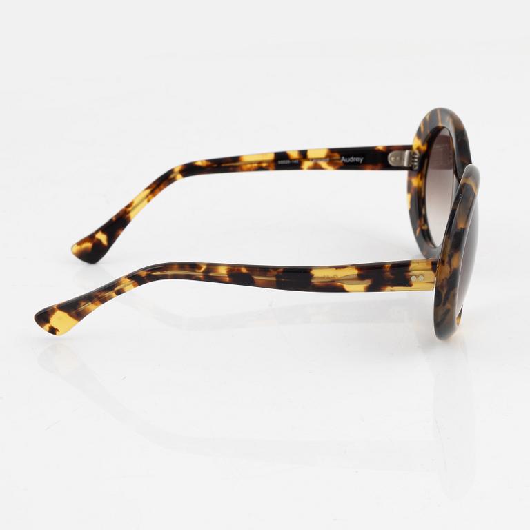 Oliver Goldsmith, a pair of "Audrey" sunglasses.