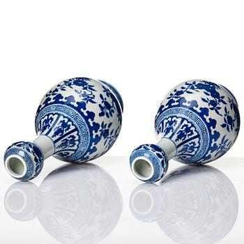 A pair of Chinese blue and white vases, late Qing dynasty/Republic with Qianlong seal mark.