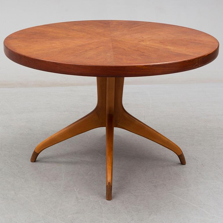 A teak and beech dining table and 6 chairs. Mid 20th century.