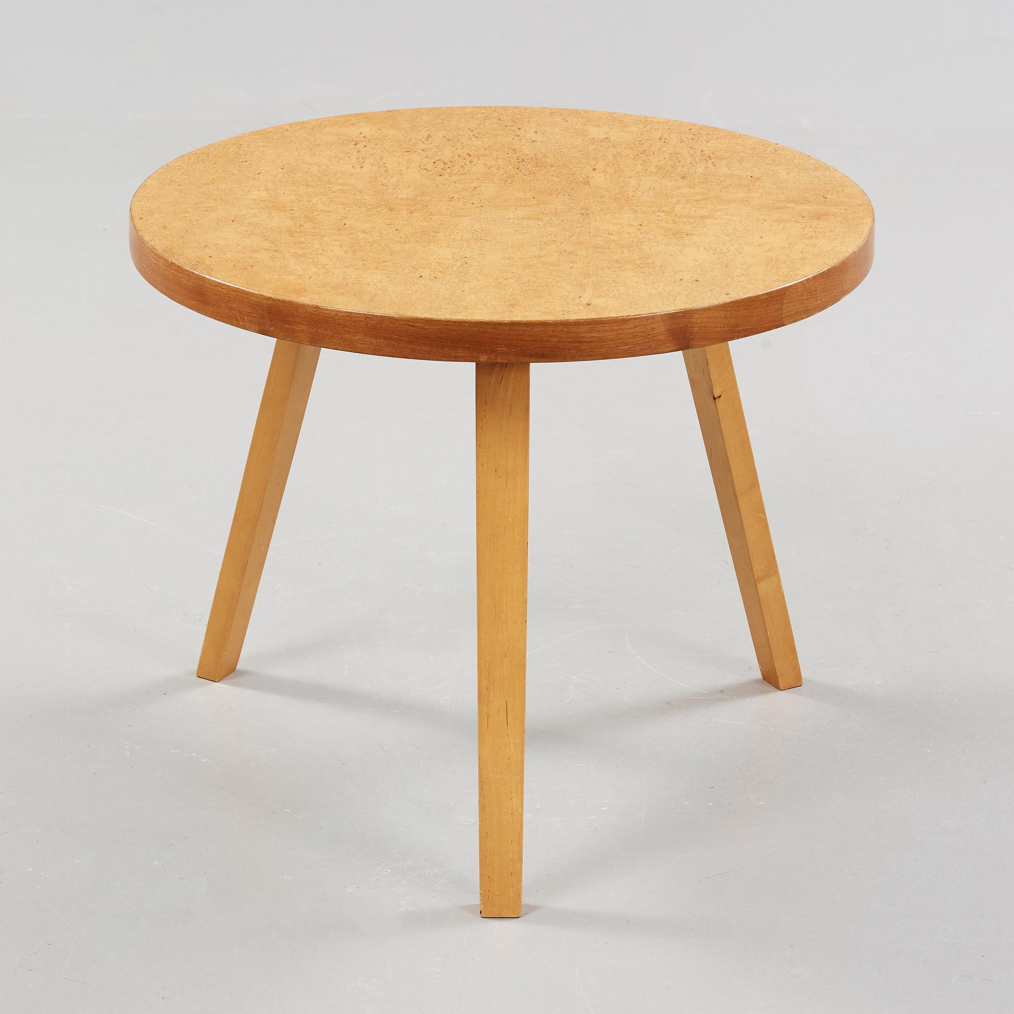 An Alvar Aalto curly birch table, made on license by Aalto Design Hedemora for Artek, Sweden 1946-56.