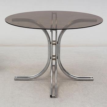 An Italian set of a glass table with four chromed metal chairs, 1970s.