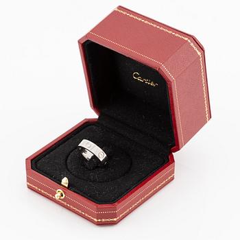 Cartier "Love" ring in 18K white gold with three round brilliant-cut diamonds.