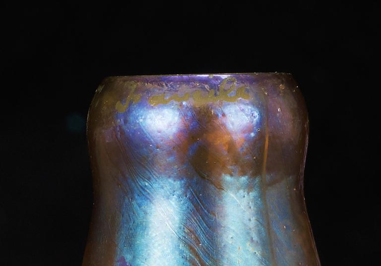 A Tiffany Studios 'Three Lily' lamp with a bronze base, New York circa 1910.