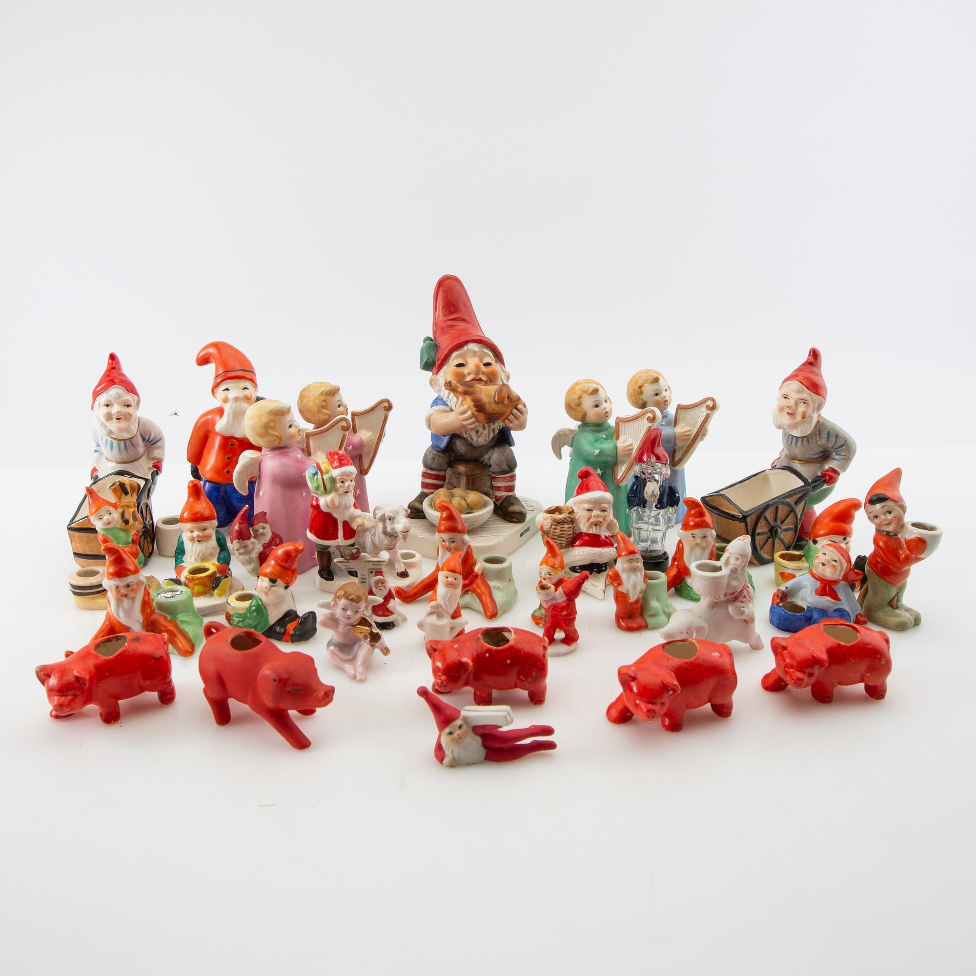 A collection of gnomes, angels, and pigs, approximately 41 pcs, 20th century.