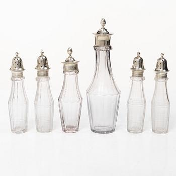 Parts for a table centrepiece, six glass bottles, and seven lids in silver, marked Pehr Zethelius, Stockholm 1807.