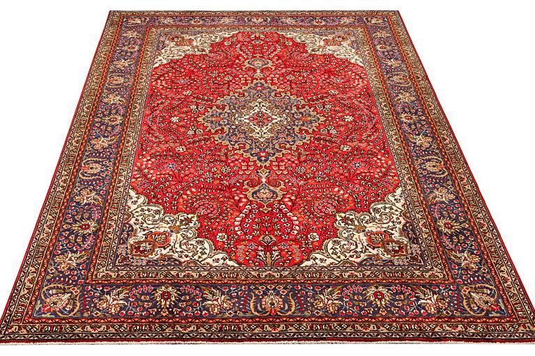 A Tabriz carpet, c 295 x 198 cm.
