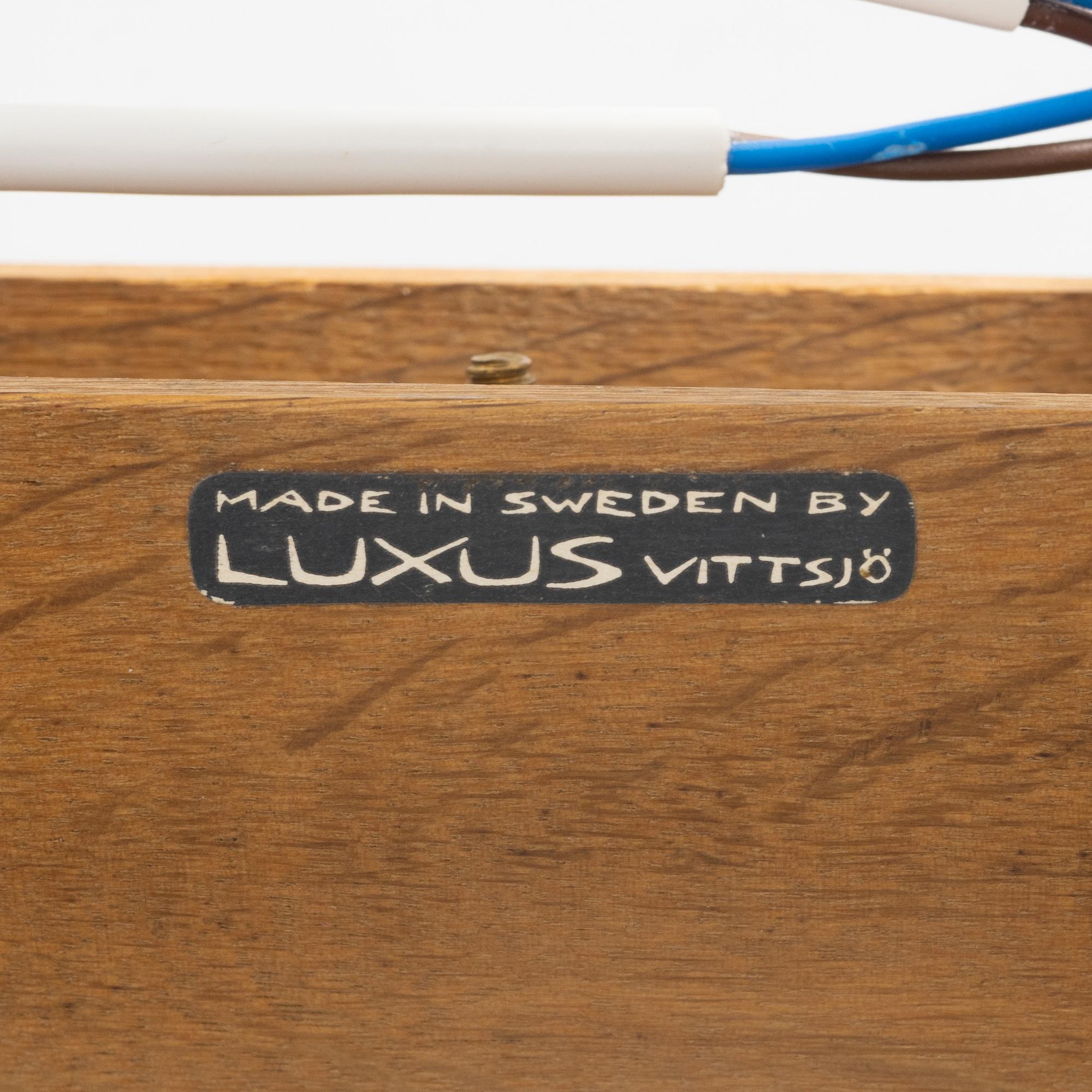 Uno & Östen Kristiansson, a large glass and oak, ceiling light, Luxus, Vittsjö.