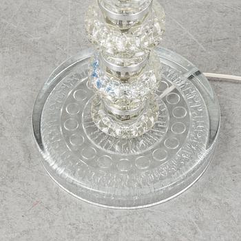 A glass floor lamp.