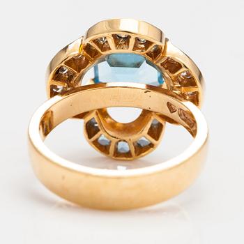 An 18K gold ring "Catherine Jagiellon" with diamonds ca 0.37 ct in total and topazes. Ofelia Jewelry, Helsinki 1998.
