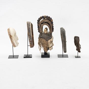 Five mask reportedly from Kwele, Gabon, Fang, Gabon, Bakwele, Gabon,  and moore,from the second half of the 20th century.