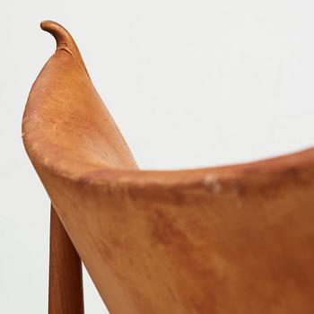 Finn Juhl, a teak and natural brown leather "Chieftain Chair" by Niels Vodder, 1950-60's.