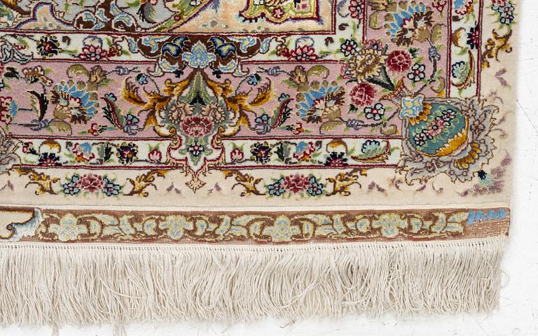 A Tabriz rug, signed, c. 160 x 101 cm.